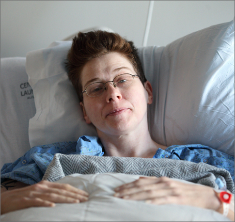 Woman in a hospital bed.